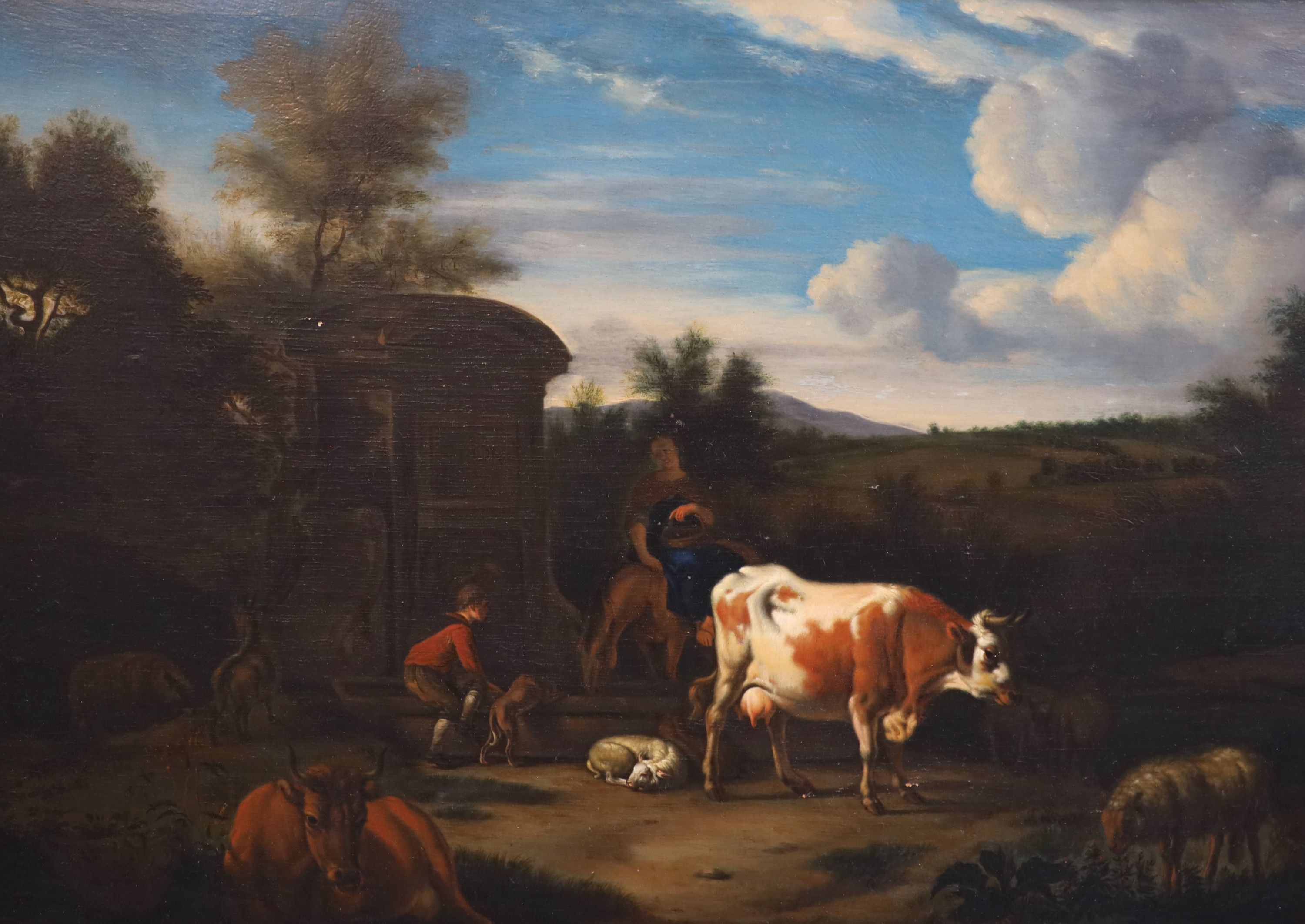 Circle of Dirk Van Den Bergen (1645-1689), Landscape with figures, cattle and sheep beside a Roman well, oil on wooden panel, 34 x 48cm